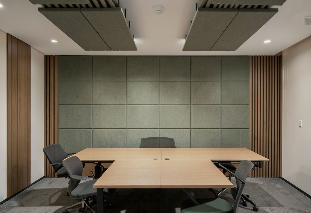 Custom acoustic panels absorbing echo in a modern interior