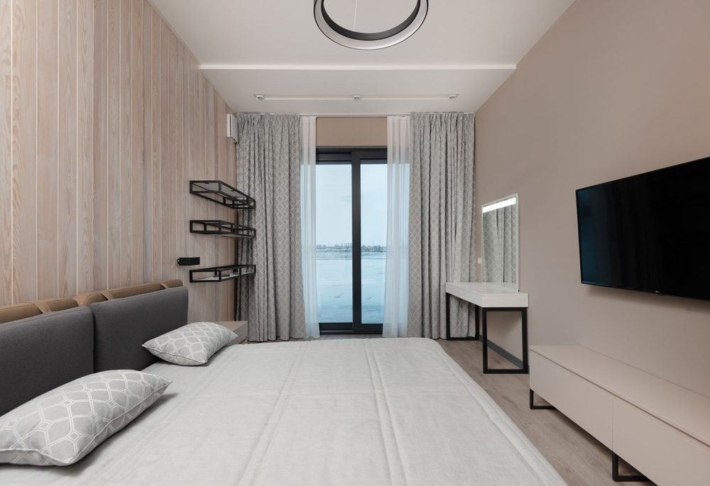 Wall mounted television in a bedroom, a common source of noise transfer between rooms