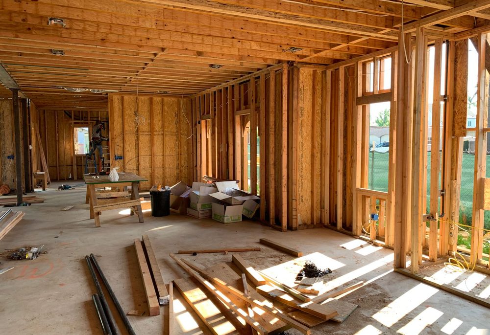 Timber stud framing in an unfinished interior, the stage at which wall soundproofing costs least